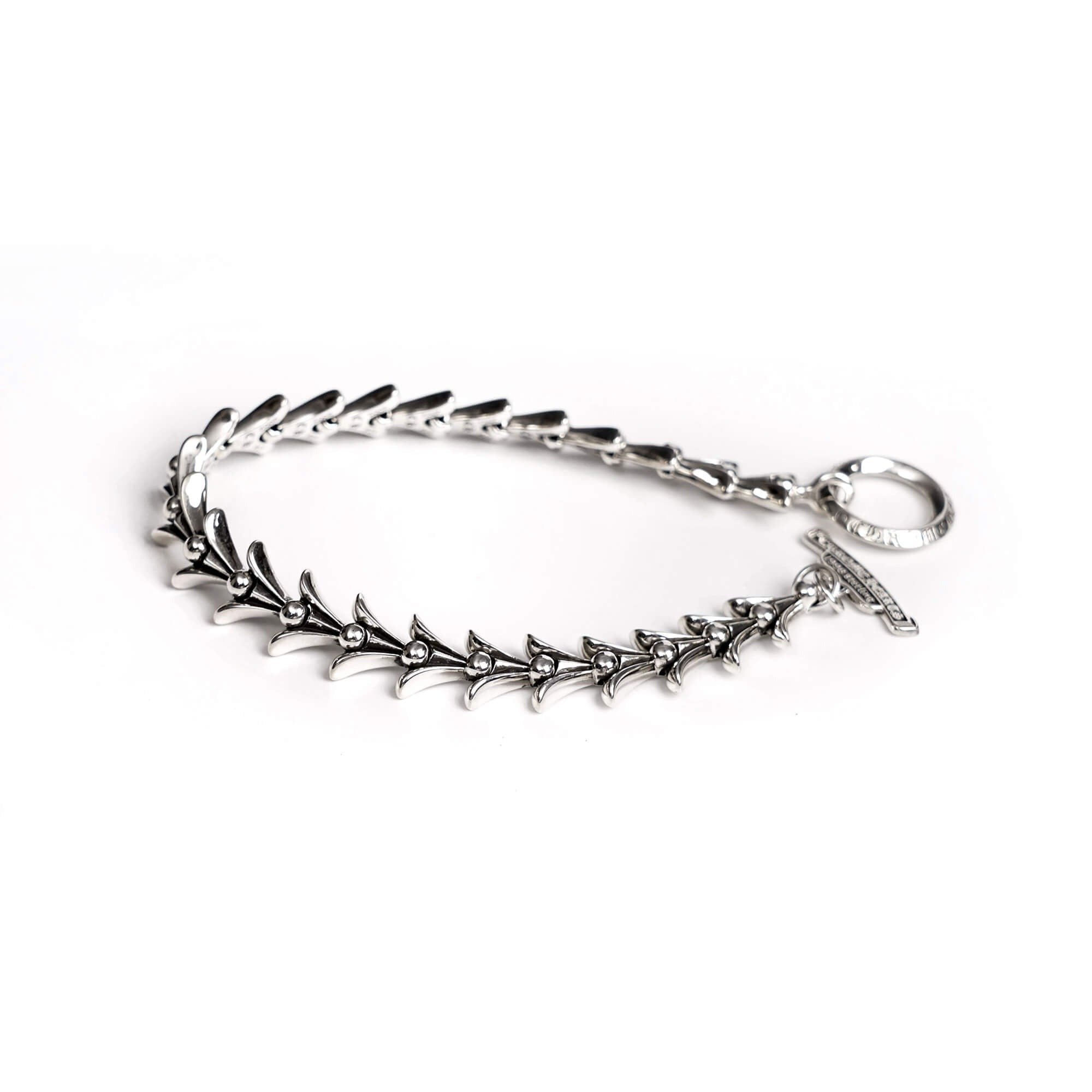 authentic chrome hearts crosstail bracelet with logo tag - premium designer jewelry front view