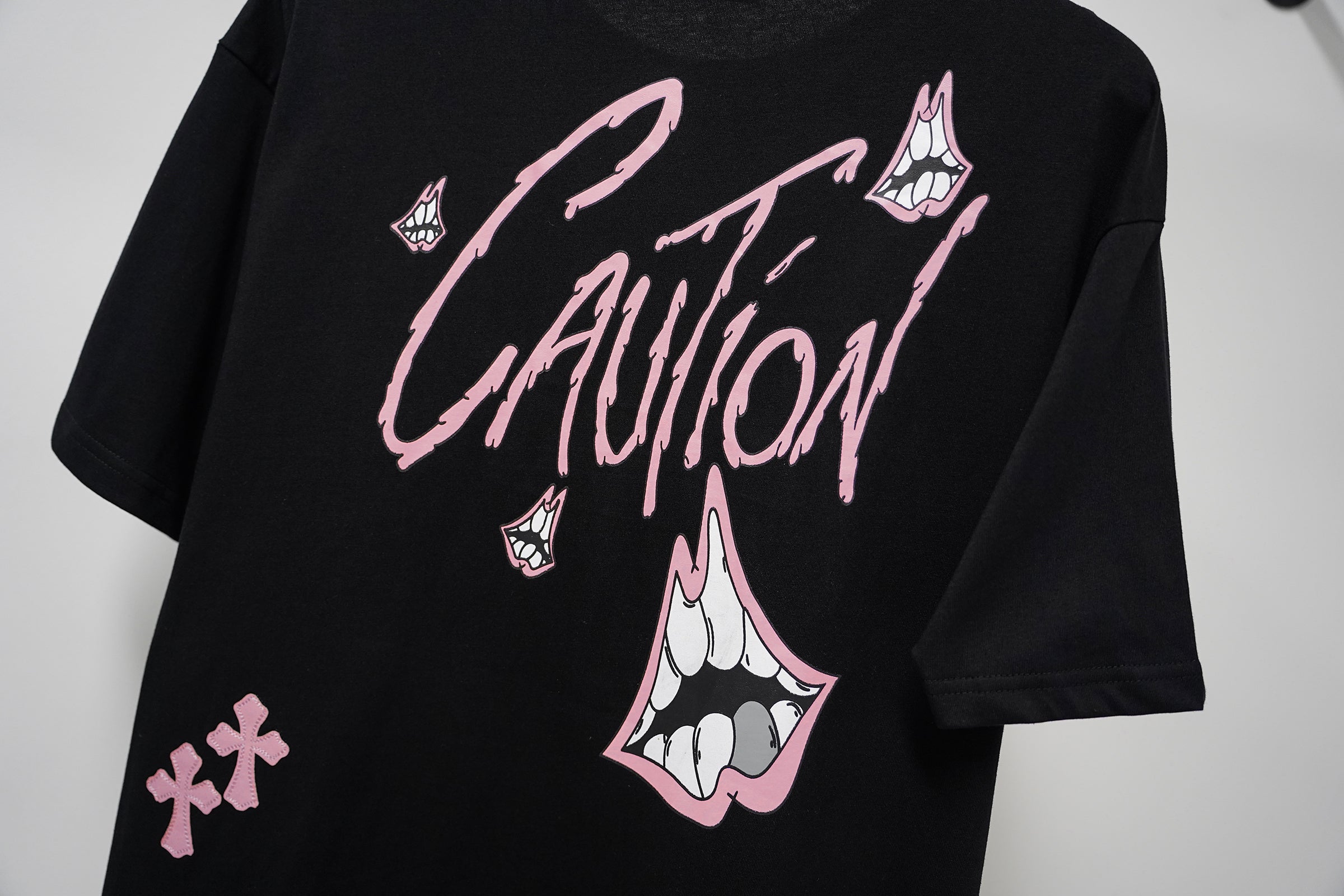 authentic chrome hearts pink caution cross graphic black tee shirt - premium designer jewelry front view