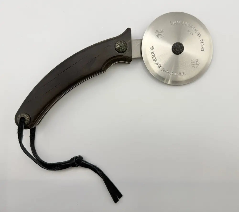 authentic chrome hearts pizza cutter - premium designer jewelry front view